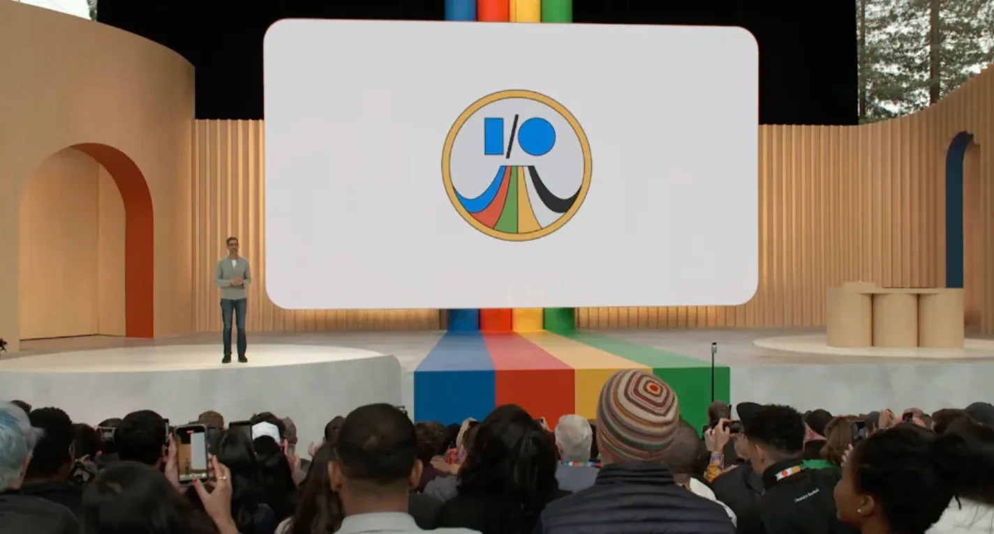 A photo of a large crowd of people gathered at the Amphitheatre for the Google I/O 2023 developer conference.